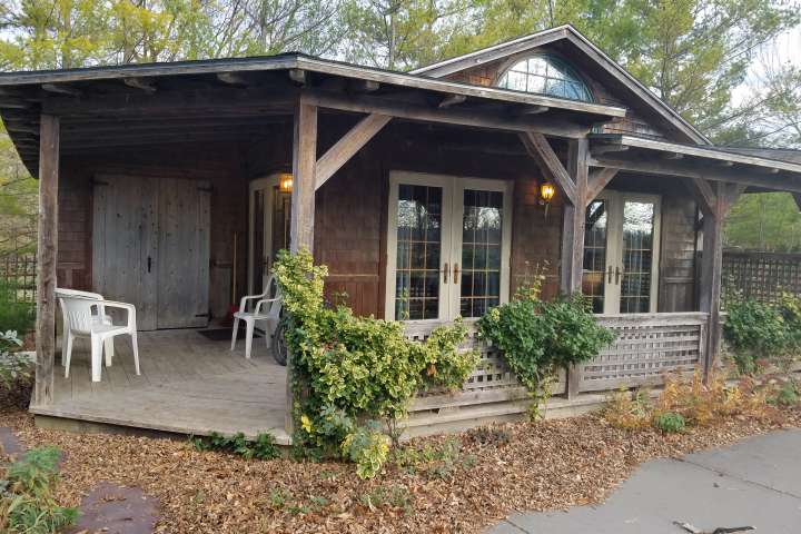 A pool cottage next to an alpaca paddock sits empty and is ready for its next guests to book their vermont farm stay.